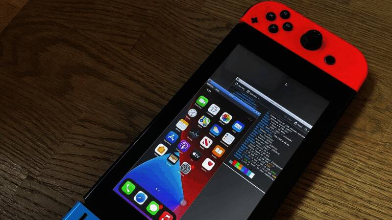 初代Switch主机与iOS界面同框，屏幕上显示着极慢加载的苹果标志