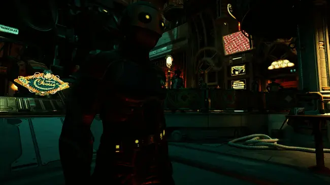 游戏总监Brandon Adler接受采访现场照片，背景为《天外世界2》宣传画面