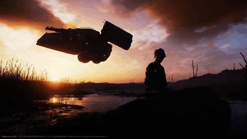 《死亡搁浅2》游戏画面展示主角穿越复杂地形，远处有巨型机械装置