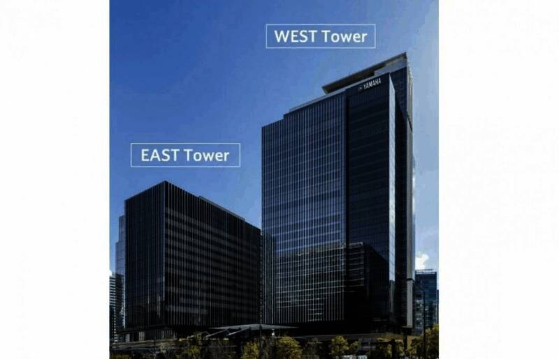 开放式办公区概念图，宽敞明亮的空间内设有先进环保设施