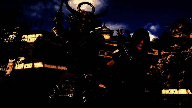 育碧CEO Yves Guillemot在公开活动中的演讲画面，神情严肃，背景为育碧经典游戏合集展示