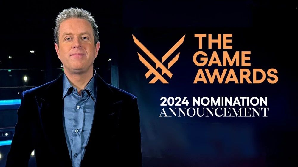 TGA主持人Geoff Keighley在舞台上的演讲画面，背景为TGA标志性灯光与LOGO