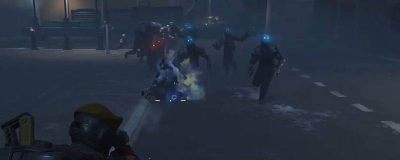 《绝地潜兵2》中光能族敌人在战场上成群出现，部分单位散发蓝色能量光效，背景为外星地表战场