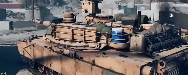 《战地6》中M1A2艾布拉姆斯坦克在城市废墟间行驶，炮管高扬，履带碾过碎石，背景硝烟弥漫