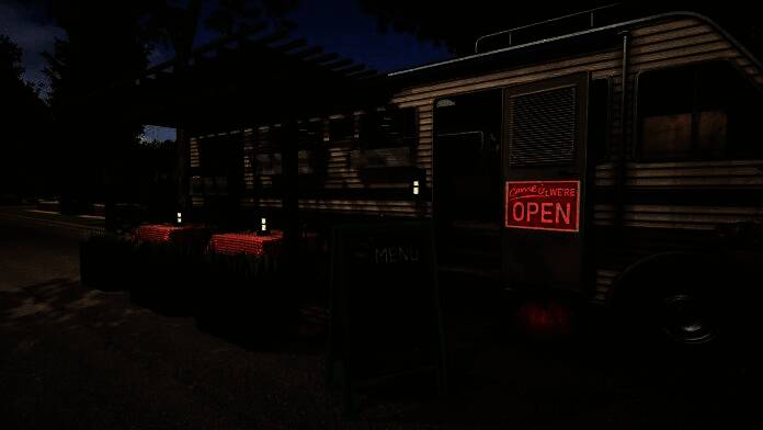 改装后的大巴内部全景，现代风格装潢，配有沙发、厨房和床铺，宛如小型公寓