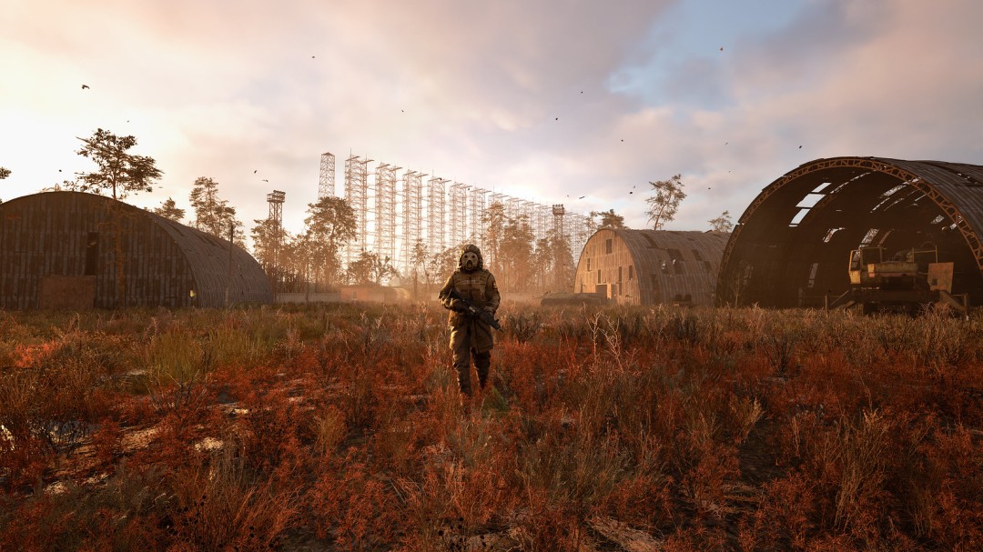 枢纽内部场景，技师正在维修武器，商人整理货架，背景有篝火照明